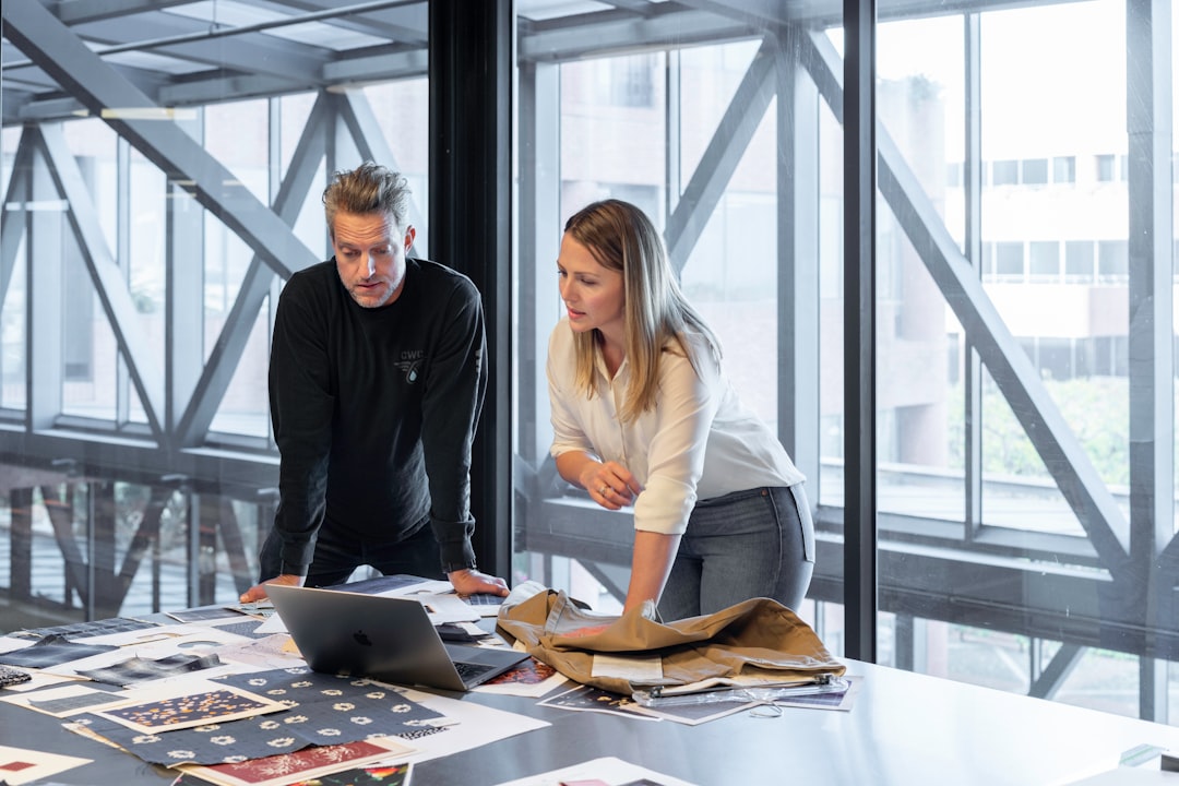 Business team discussing software project planning in a meeting room (Photo by LinkedIn Sales Solutions on Unsplash)